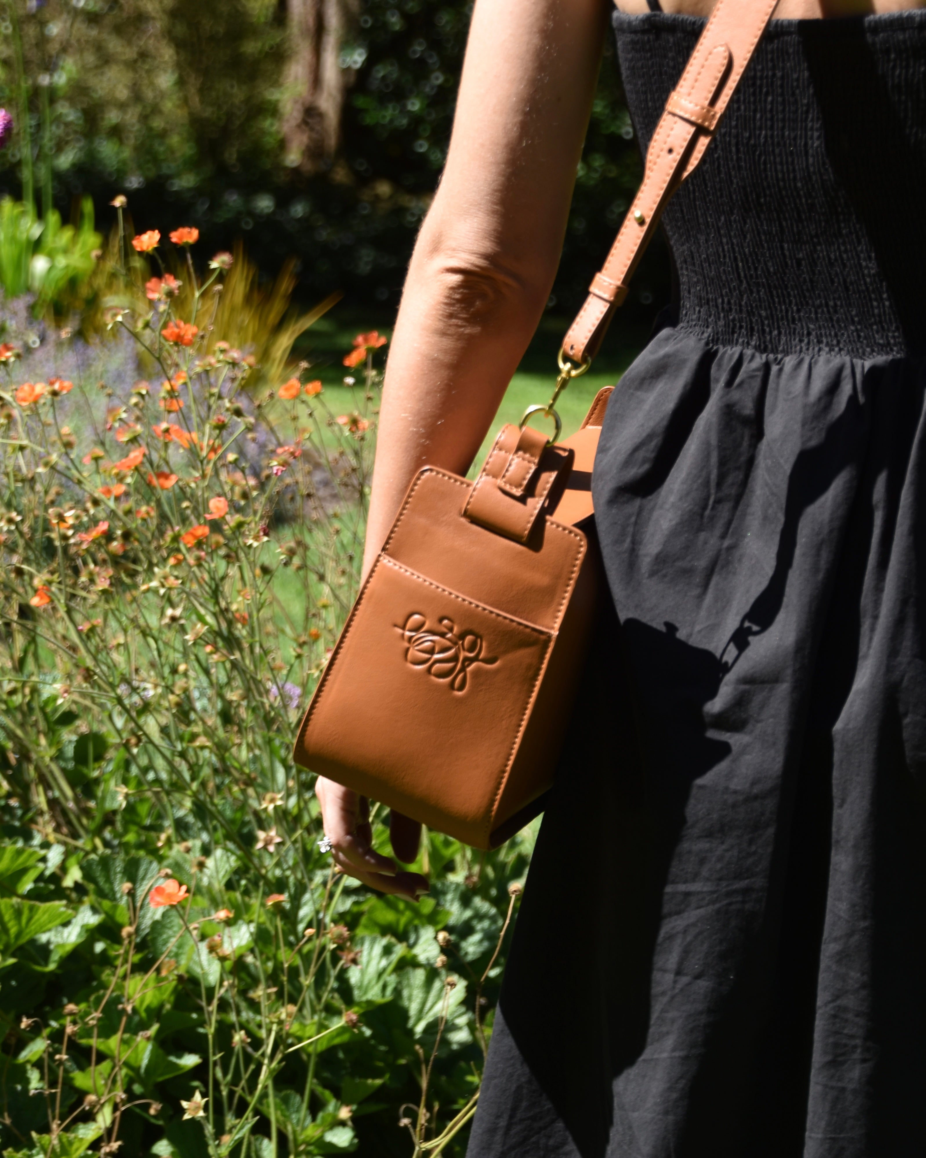RHEA-Pram-Bag-Saddle-Tan-as-cross-body-bag