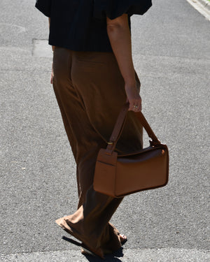 RHEA-Pram-Bag-Saddle-Tan-as-handbag