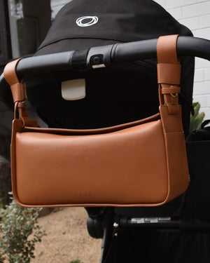 RHEA-Pram-Bag-Saddle-Tan-on-pram