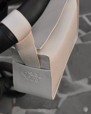 RHEA-Pram-Bag-Oat-Milk-on-pram-handlebars